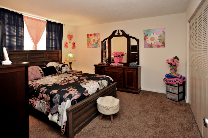Corridor to enter the apartments with vegetation on the sides