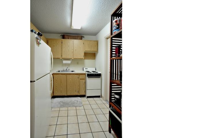 Kitchen with refrigerator and stove